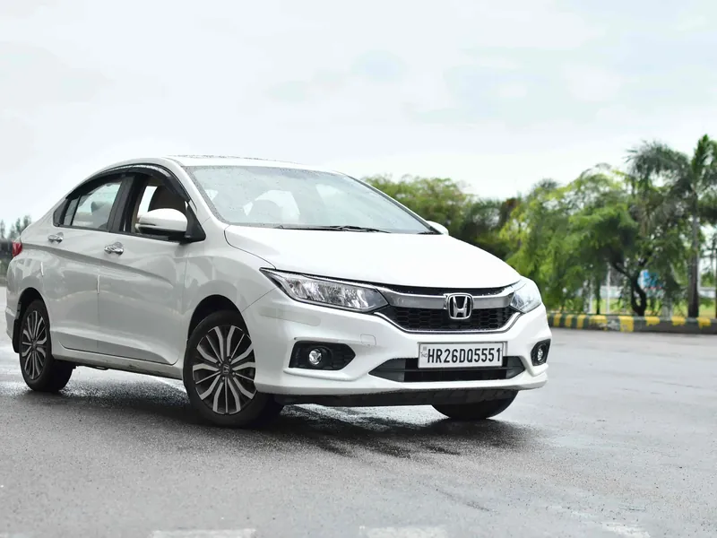 Honda City sedan waiting for an airport pickup at Mangalore International Airport